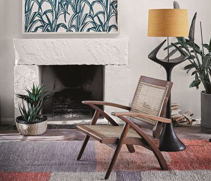 Wood and rattan chair in front of fireplace 