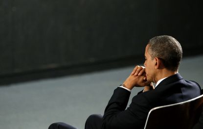 President Obama prays during a service in 2012.