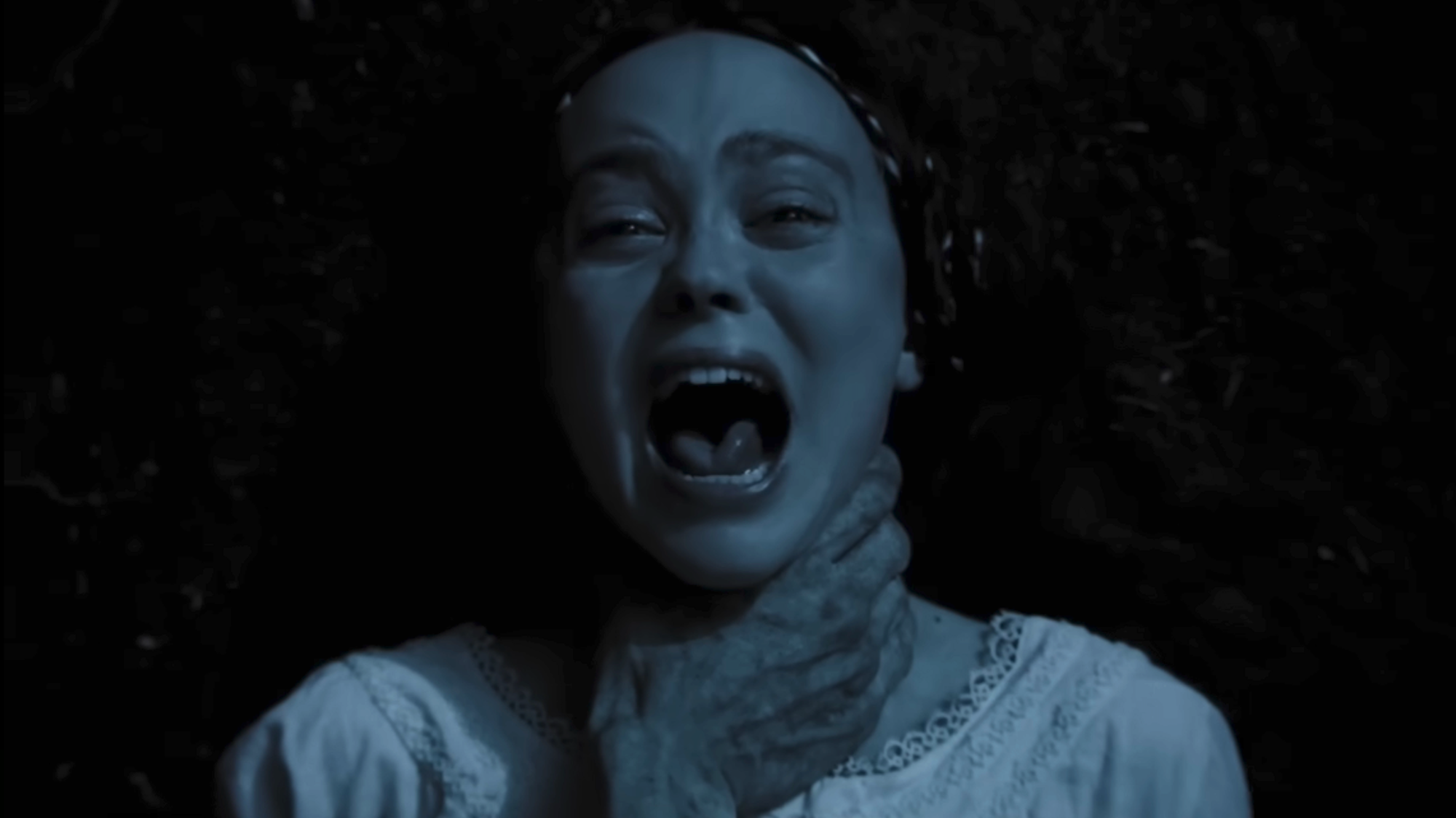 Lily-Rose Depp screaming while being choked in Nosferatu
