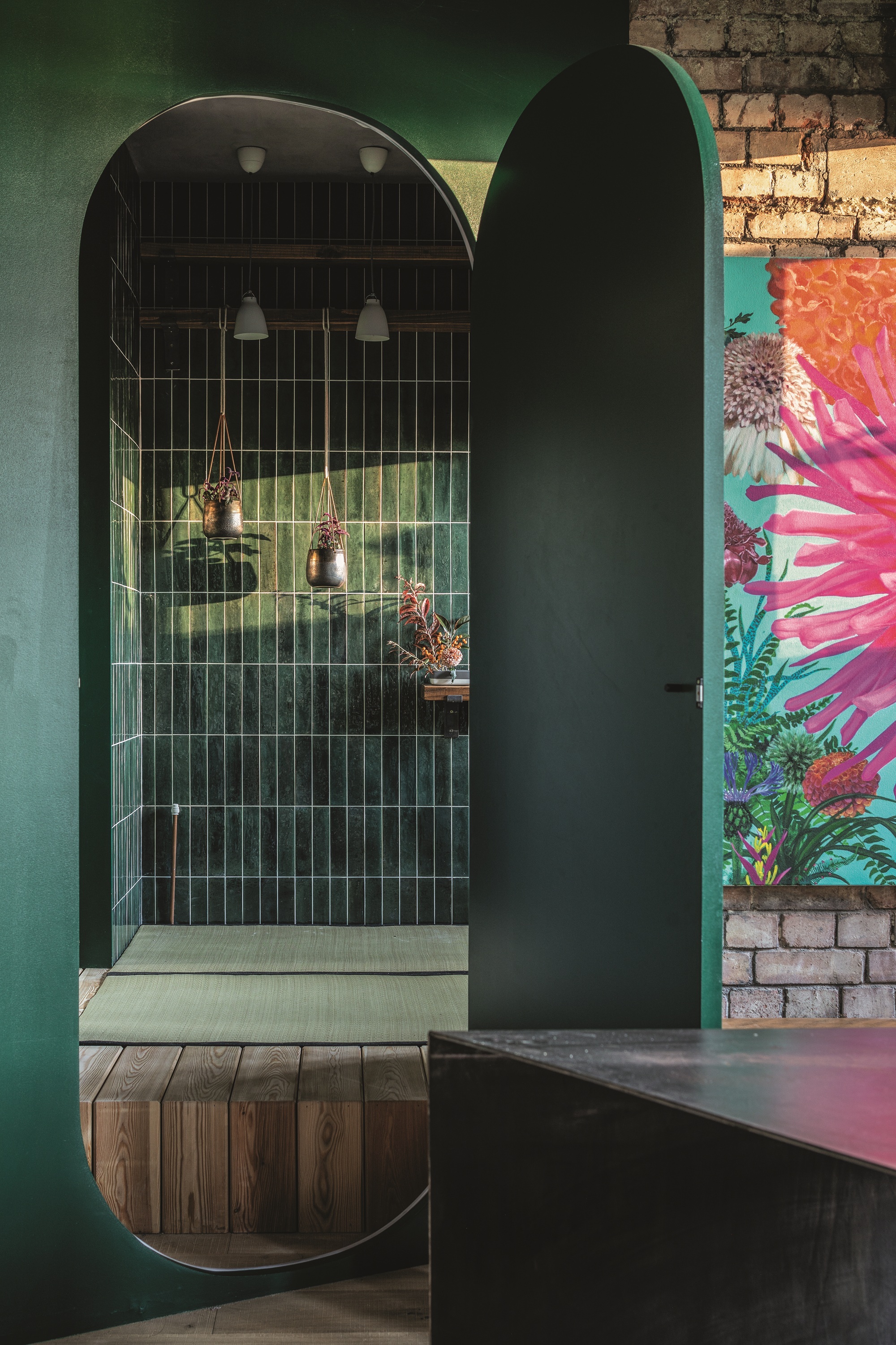 Brass flower pendant light, by Expand Life Metal Art, from Etsy. Japanese toilet, find similar from Toto. Gilt mirror, client&amp;rsquo;s own; find similar from Gilt &amp;amp; Grain.
