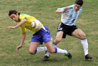 Javier Zanetti (right) competes for the ball with Brazil's Edu in the final of the 2004 Copa America.