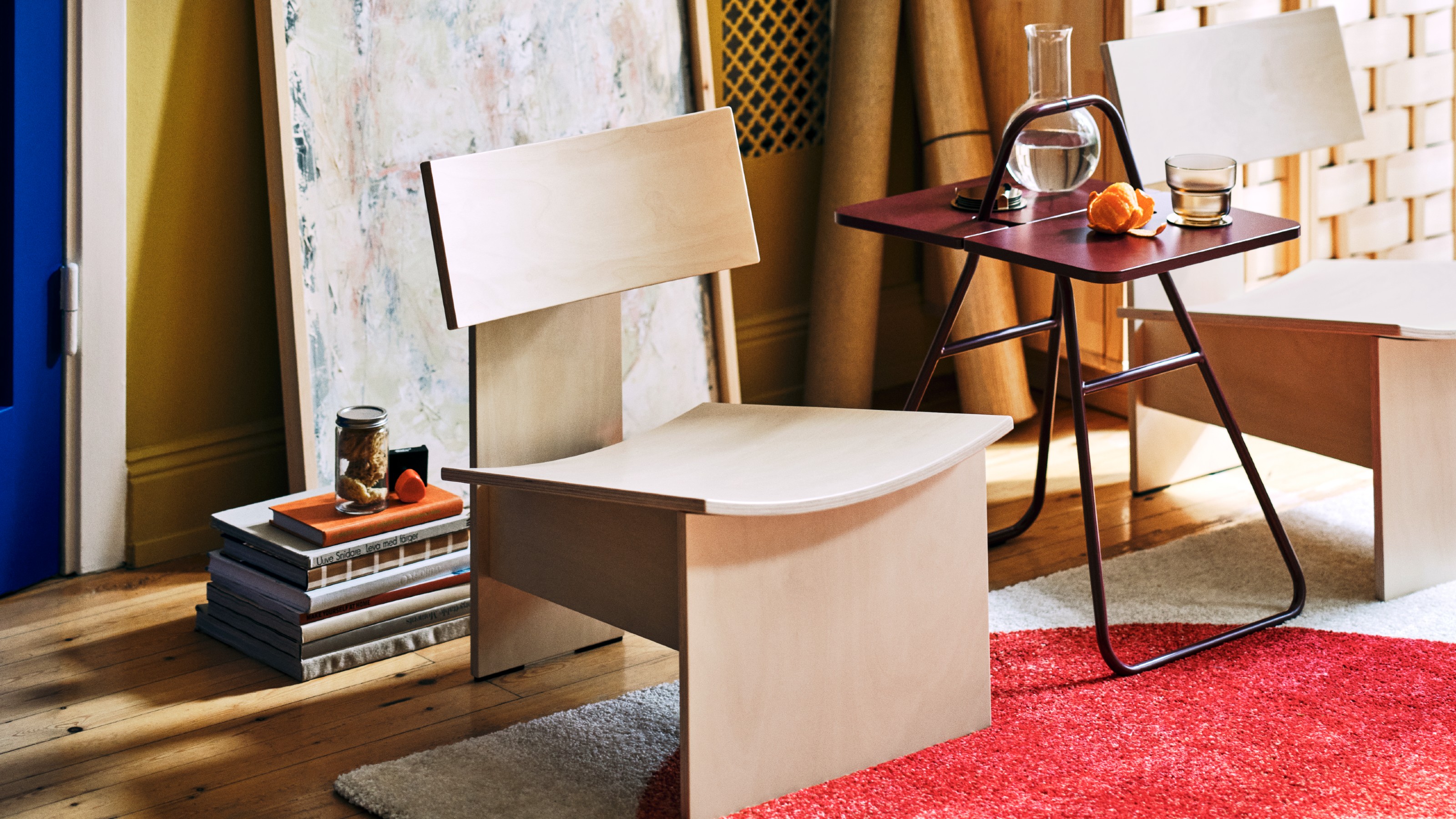 A room with two of the IKEA PS 2026 easy chairs and the folding table in the middle
