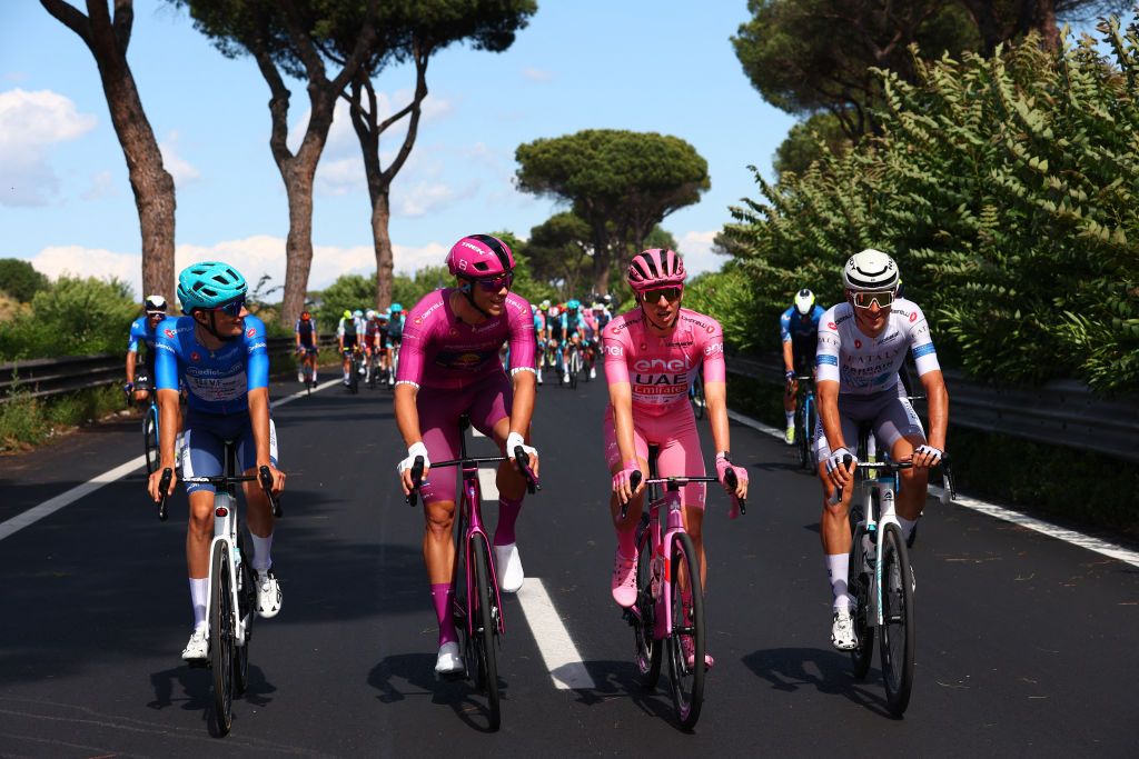 (From L) Team Bardiani's Italian rider Giulio Pellizzari wearing the best climber's blue jersey (second placed in the blue jersey ranking), Team Lidl-Trek's Italian rider Jonathan Milan wearing the best sprinter's purple (cyclamen) jersey, Team UAE's Slovenian rider Tadej Pogacar wearing the overall leader's pink jersey and Team Bahrain's Italian rider Antonio Tiberi wearing the best young rider's white jersey cycle during the 21st and last stage of the 107th Giro d'Italia cycling race, 125km from Rome to Rome on May 26, 2024. (Photo by Luca Bettini / AFP)