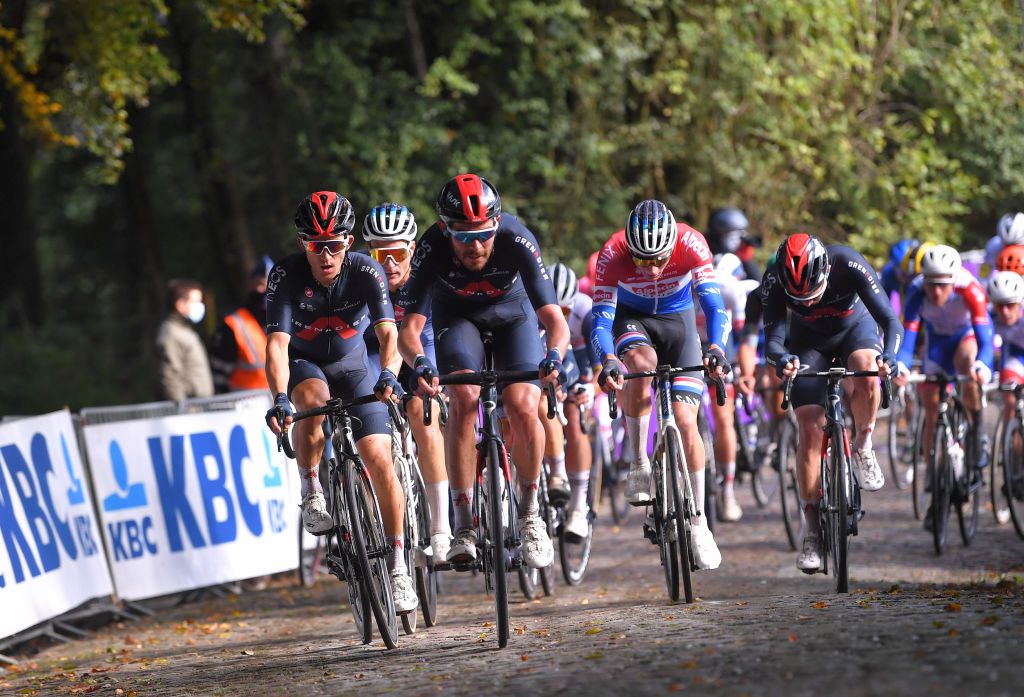 WEVELGEM BELGIUM OCTOBER 11 Michal Kwiatkowski of Poland and Team INEOSGrenadiers Luke Rowe of The United Kingdom and Team INEOSGrenadiers Mathieu Van Der Poel of The Netherlands and Team AlpecinFenix Owain Doull of The United Kingdom and Team INEOSGrenadiers Cobblestones during the 82nd GentWevelgem In Flanders Fields 2020 Men Elite a 2325km race from Ypres to Wevelgem GentWevelgem FlandersClassic on October 11 2020 in Wevelgem Belgium Photo by Luc ClaessenGetty Images