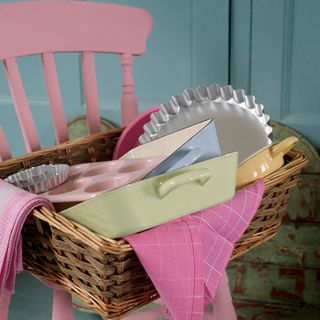 pink painted wood kitchen chair with basket