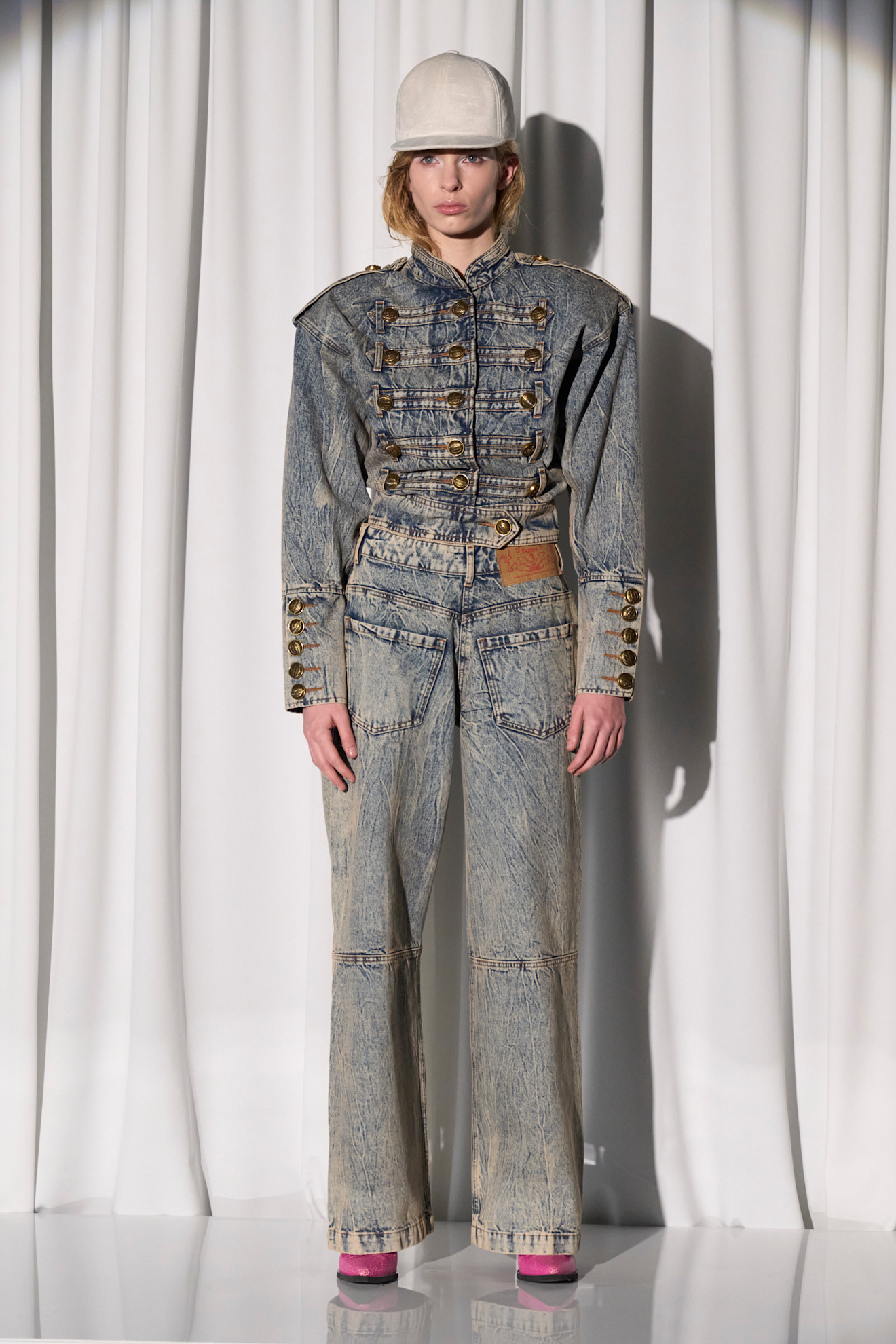 a model wearing a denim military jacket and jeans at Vaquera spring 2026