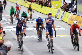 PONTIVY, FRANCE - JUNE 28: Tim Merlier of Belgium and Team Alpecin-Fenix stage winner celebrates at arrival, Jasper Philipsen of Belgium and Team Alpecin-Fenix, Nacer Bouhanni of France and Team ArkÃ©a Samsic & Davide Ballerini of Italy and Team Deceuninck - Quick-Step during the 108th Tour de France 2021, Stage 3 a 182,9km stage from Lorient to Pontivy / @LeTour / #TDF2021 / on June 28, 2021 in Pontivy, France. (Photo by Tim de Waele/Getty Images)