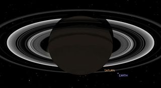 This simulated view from NASA's Cassini spacecraft shows the expected positions of Saturn and Earth on July 19, 2013, around the time Cassini will take Earth's picture. Cassini will be about 898 million miles (1.44 billion kilometers) away from Earth at t