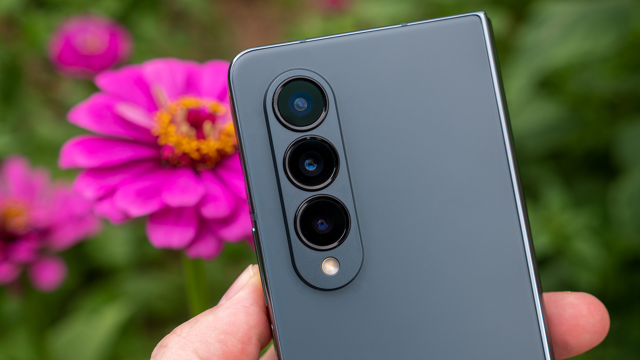 Samsung Galaxy Z Fold 4 camera module with flowers in the background
