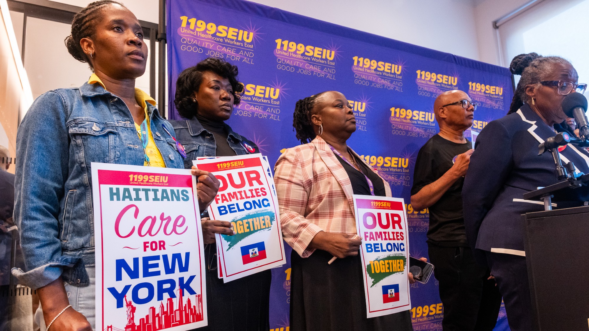 People attend a rally in support of Haitians with Temporary Protected Status