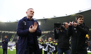 Rooney is unveiled on the pitch before kick-off against QPR