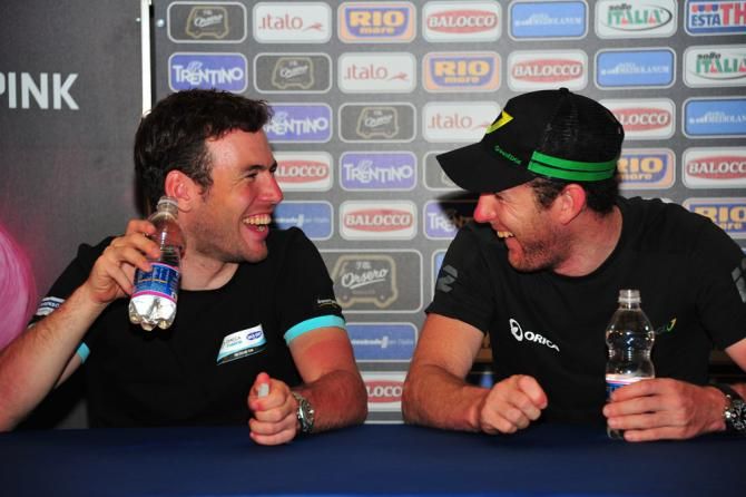 Former teammates Mark Cavendish and Matt Goss share a laugh