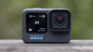 The GoPro Hero 11 Black action camera sitting on a wooden platform