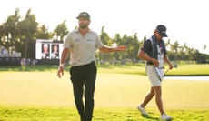 Cameron Young walks off the 18th green during the second round of Cadillac Championship at Trump National Doral - Blue Monster