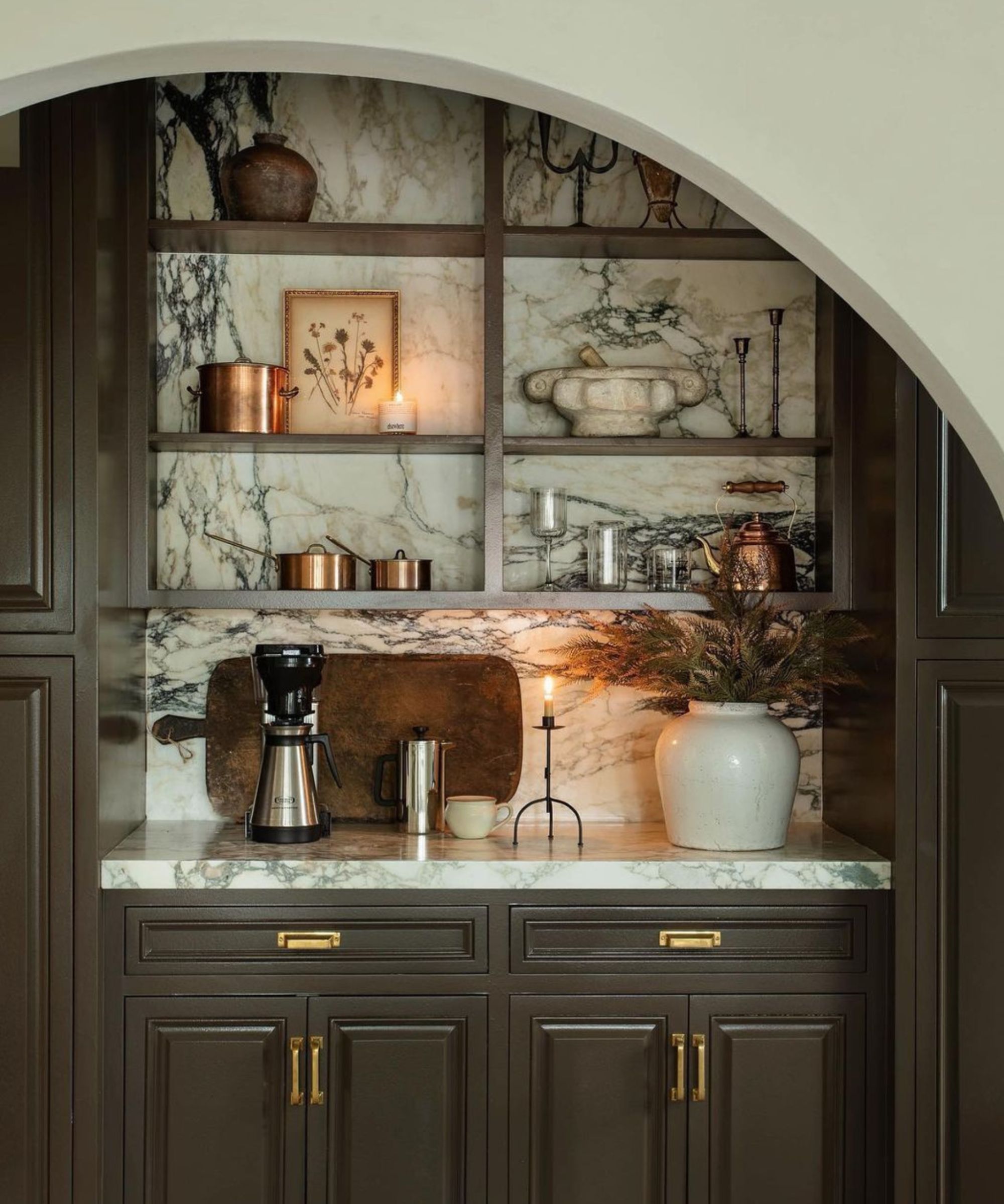 open kitchen shelving with marble backdrop