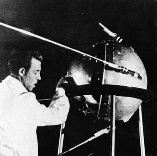 A Soviet technician works on Sputnik 1 before the satellite's Oct. 4, 1957 launch.