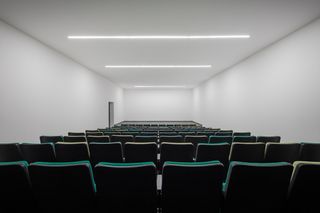 Auditorium inside a white flexible space at the Agricultural Producers building of Salvatierra
