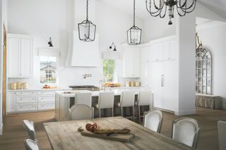 White country kitchen diner with wooden furniture