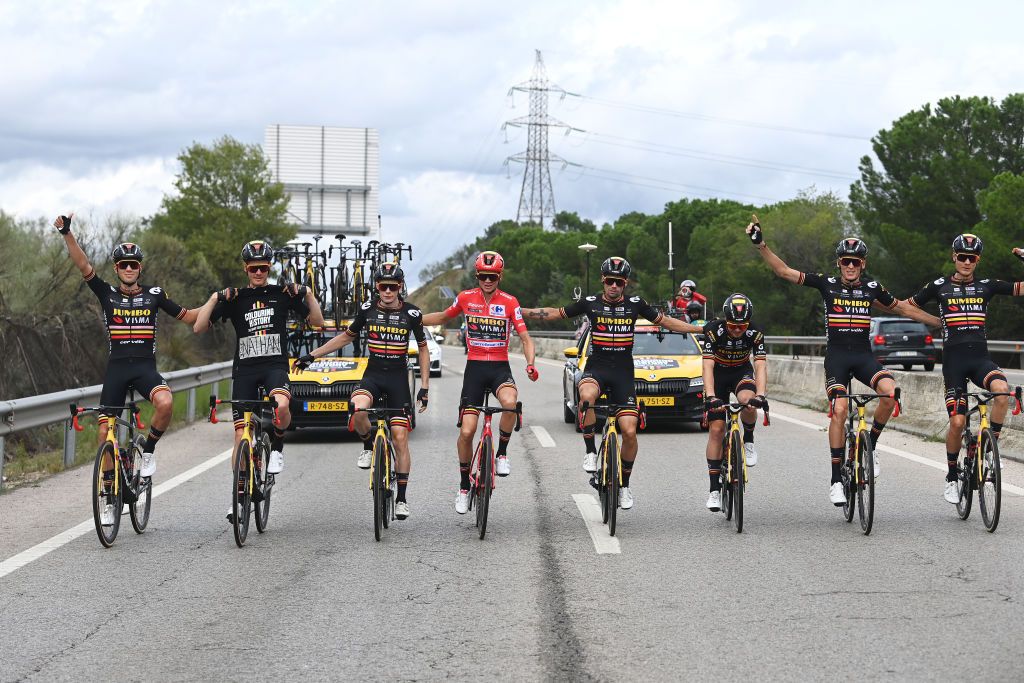 Jumbo-Visma, in their special jerseys, celebrate their third Grand Tour victory of the year