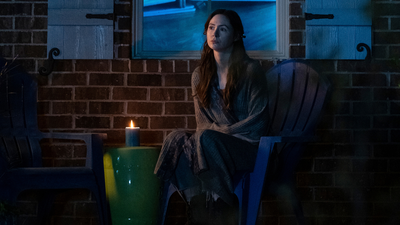 Karen Gillan sitting on a chair at night in The Life Of Chuck