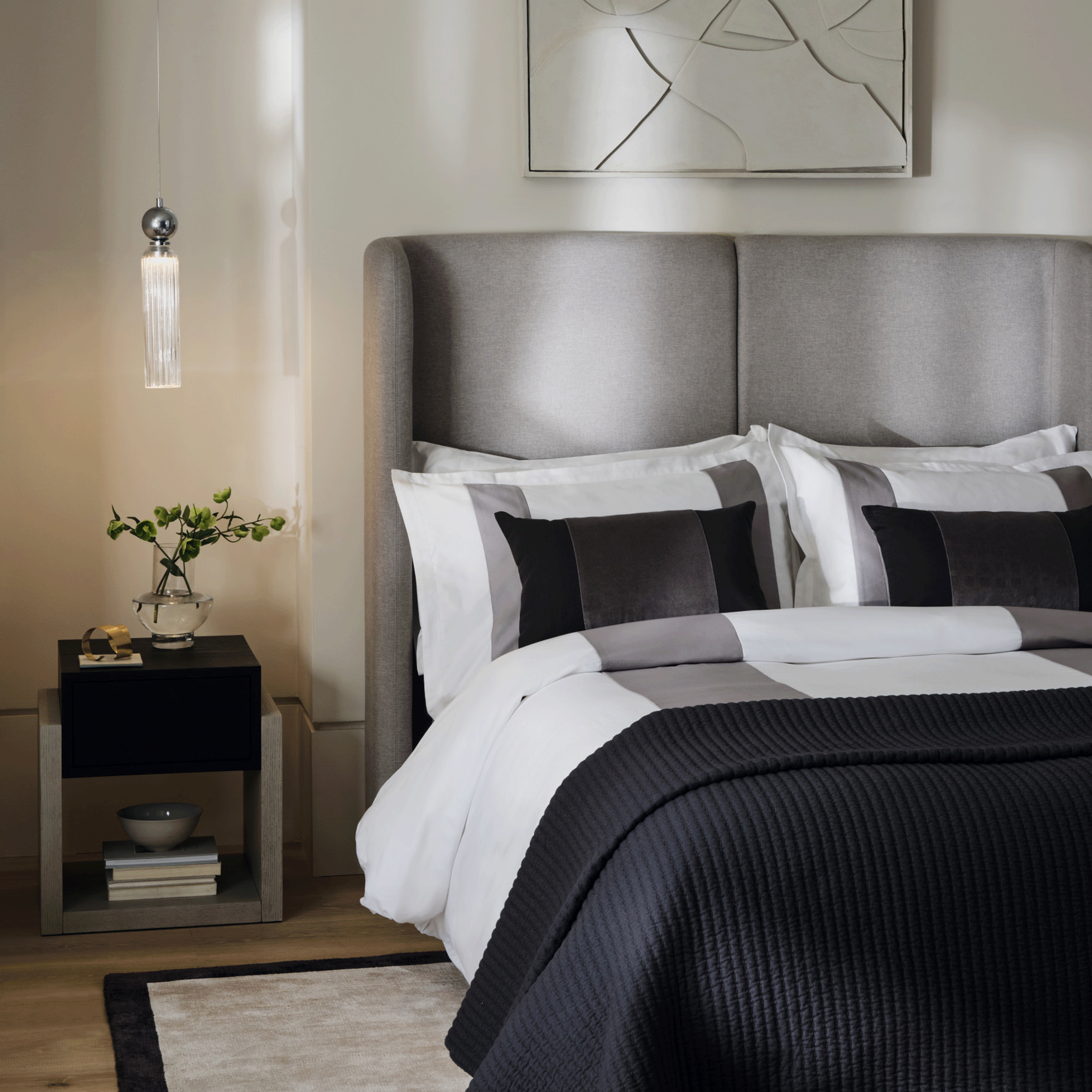 Black and white bedding in a neutral room with all the products from Marks and Spencer x Kelly Hoppen