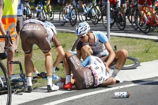 AG2R teammates look after Jean-Christophe Peraud after a crash