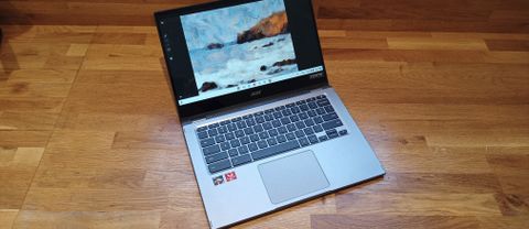 Acer Chromebook Spin 514 review; an open laptop on a wooden bench