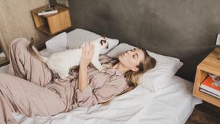 cat with woman in bed