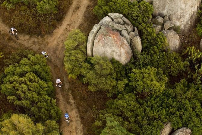 Riders race around rock features near Panorama