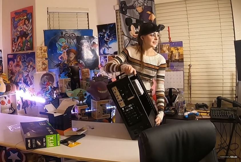 Woman displaying her custom PC