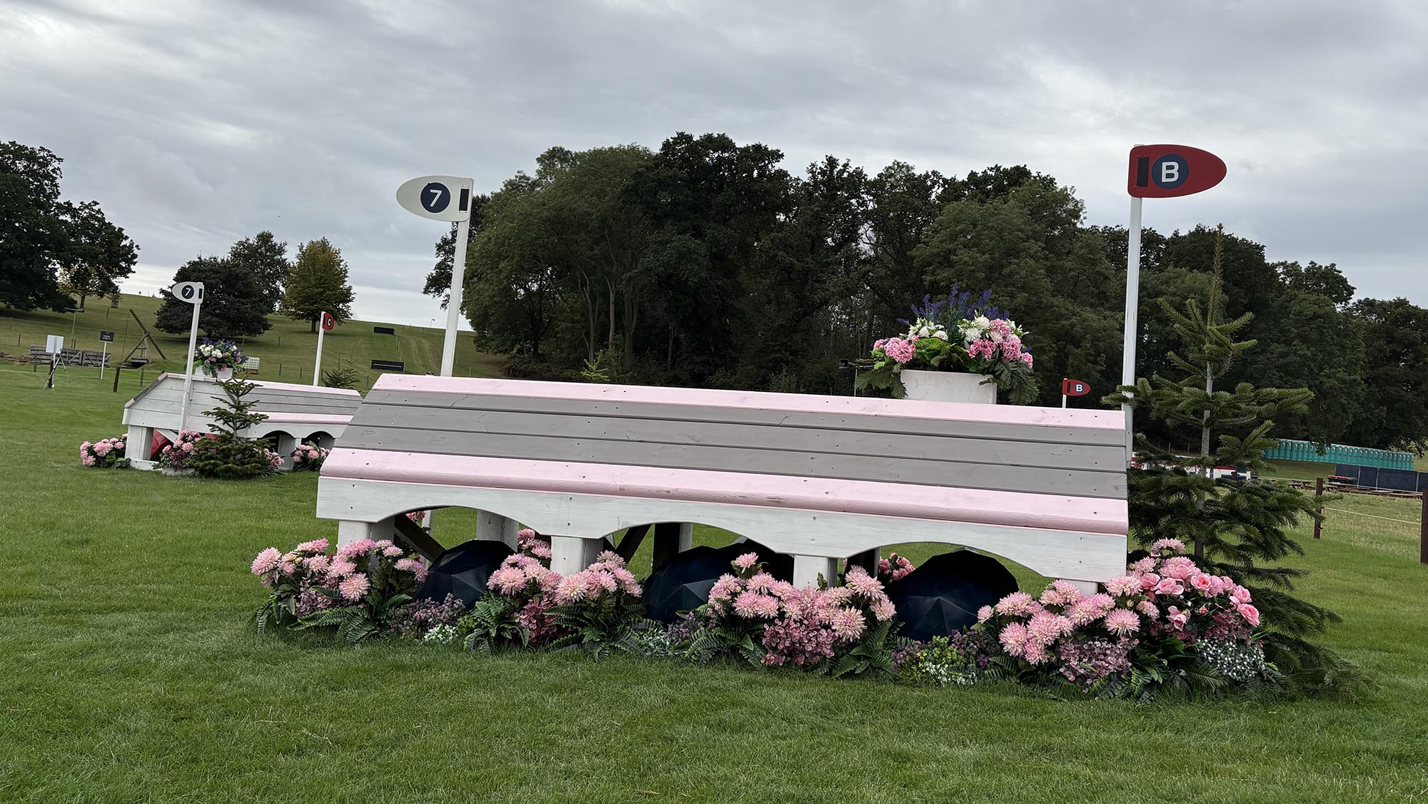 Pink, grey and white house fence on the Burghley cross-country course 2026