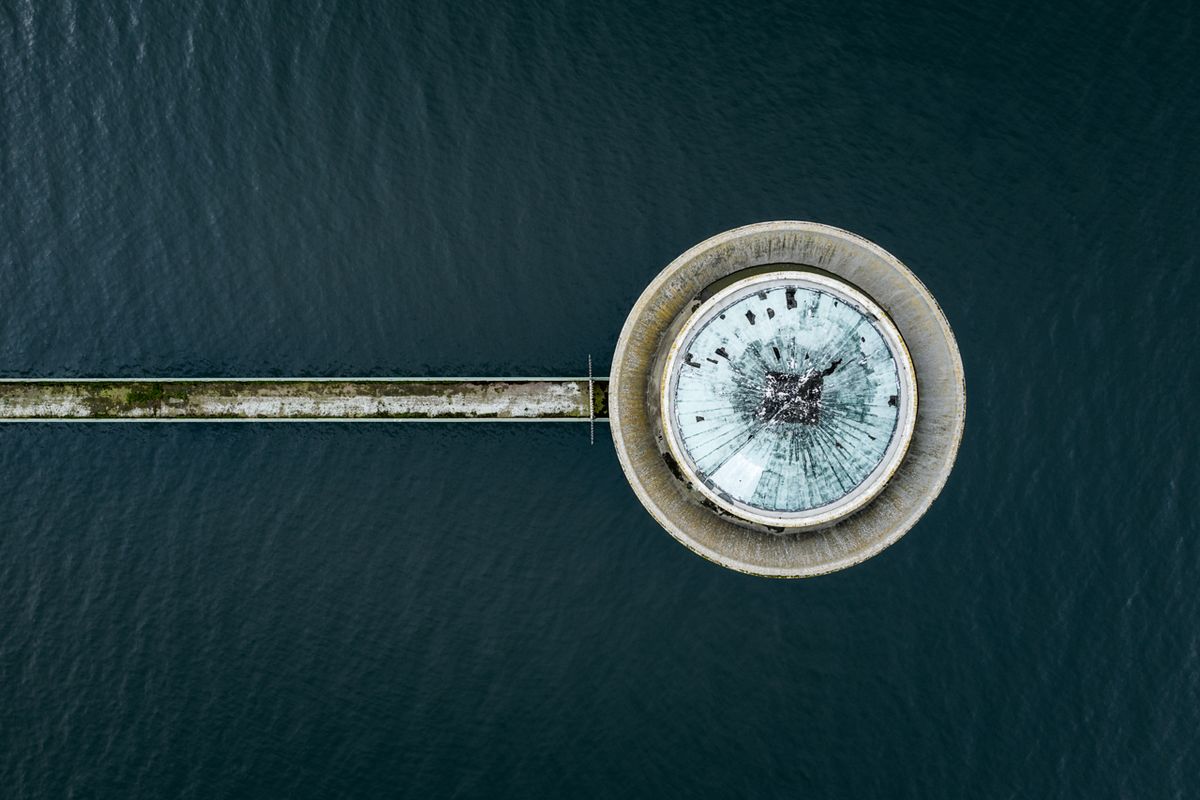 A top-down aerial view of an outbuilding at sea
