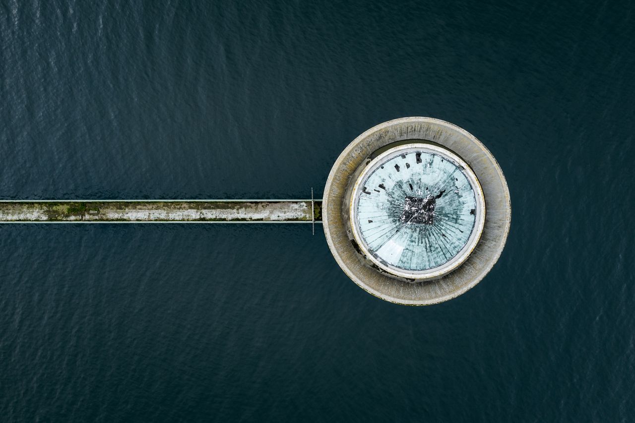 A top-down aerial view of an outbuilding at sea