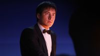 Hudson Williams as Shane Hollander wearing a tux on Heated Rivalry.