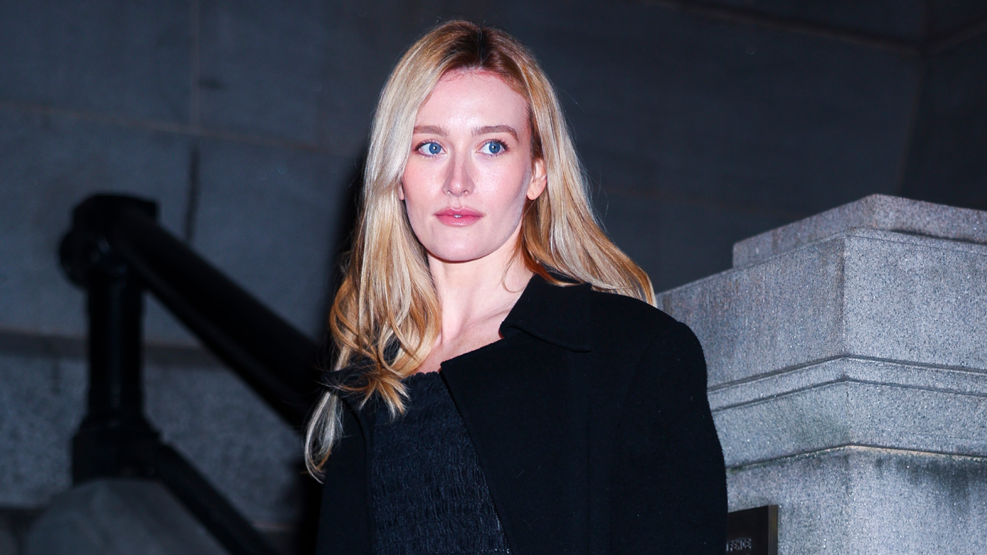 Sarah Pidgeon attends the Khaite fashion show during New York Fashion Week on February 14, 2026 wearing a sleek black outfit seemingly inspired by Carolyn Bessette-Kennedy's timeless '90s minimalism