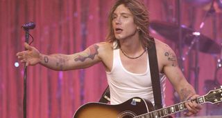 John Rzeznik of Goo Goo Dolls works the crowd with a Gibson acoustic