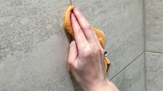 Cleaning grout with microfiber cloth