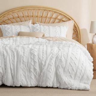 Embroidery Boho Chic Comforter Set on a bed.