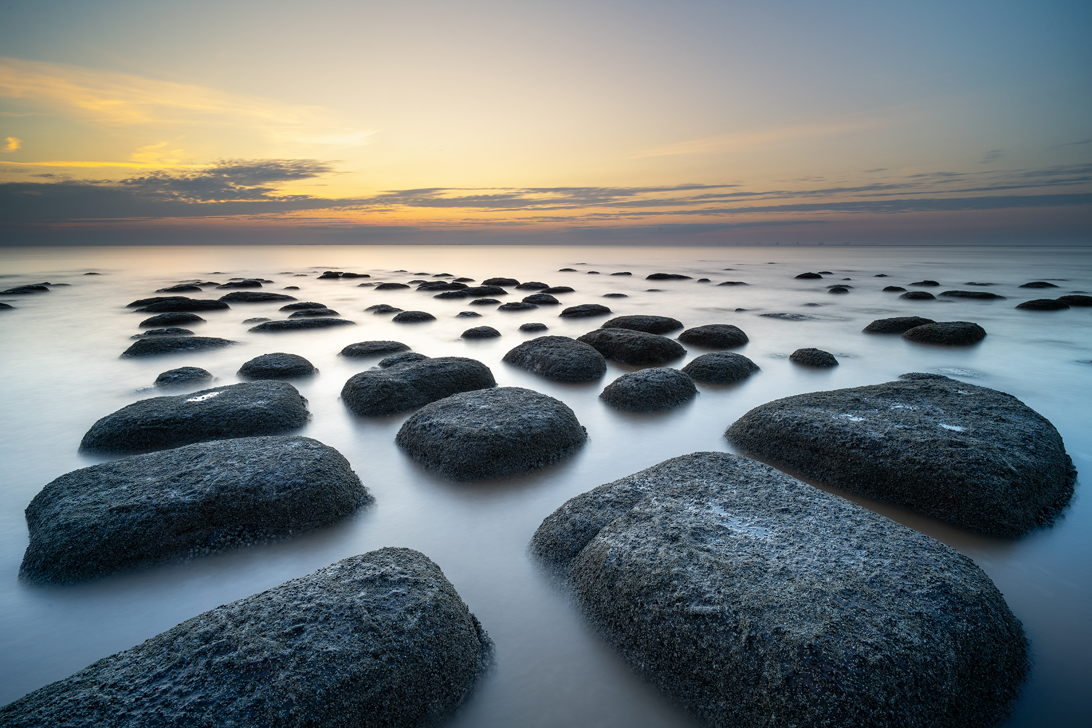 Photo of rocks in the sea taken with the Viltrox AF 16mm f/1.8 FE lens