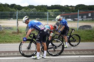 Movistar Team's Austrian rider Gregor Muhlberger and Movistar Team's Portuguese rider Nelson Oliveira recover after a crash during the 5th stage of the 111th edition of the Tour de France cycling race, 177,5 km between Saint-Jean-de-Maurienne and Saint-Vulbas, on July 3, 2024. (Photo by Anne-Christine POUJOULAT / AFP) (Photo by ANNE-CHRISTINE POUJOULAT/AFP via Getty Images)
