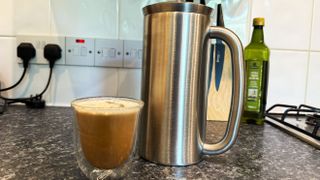 a picture of the espro p7 french press used for cold brew and a cold brew with milk beside it