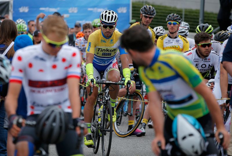 Mark Cavendish (Etixx-Quick Step) checks on whether Peter Sagan is going to join him on the start line