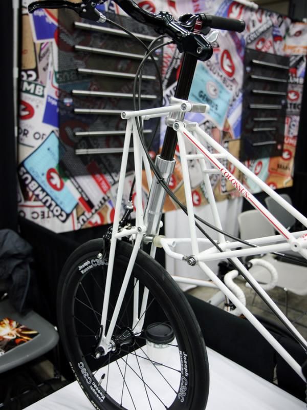 The front end of Kimori's small-wheeled bikes include a parallelogram-type suspension linkage.