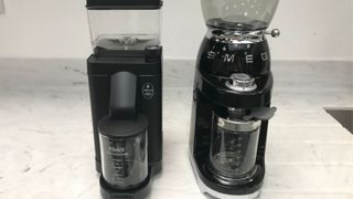 The Smeg grinder beside the moccamaster, both in black