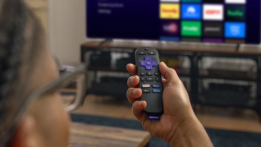 Person using Roku Streaming Stick 4K on TV