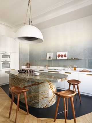 a kitchen with an ombre gilded wall