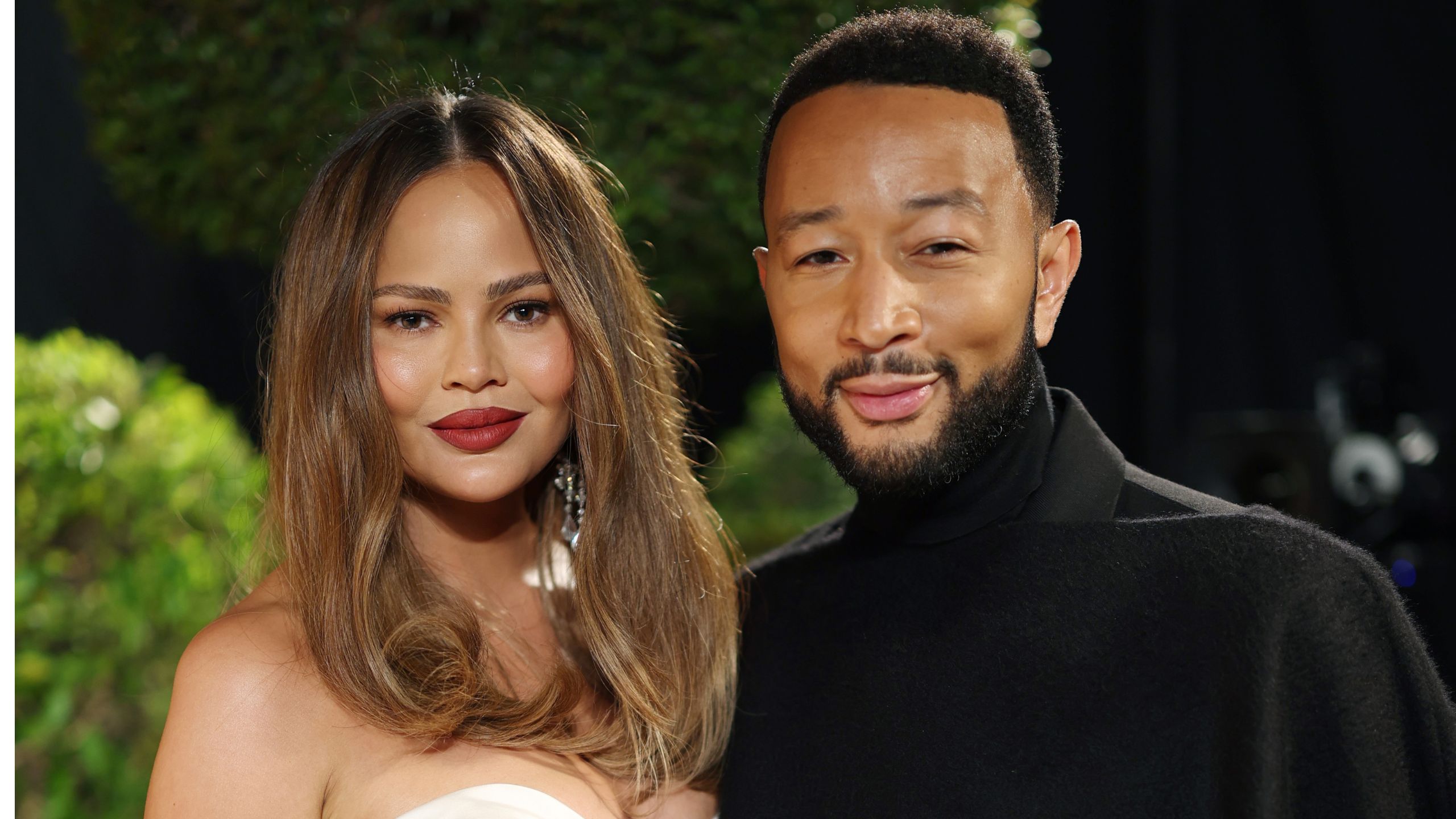 chrissy teigen and john legend outside
