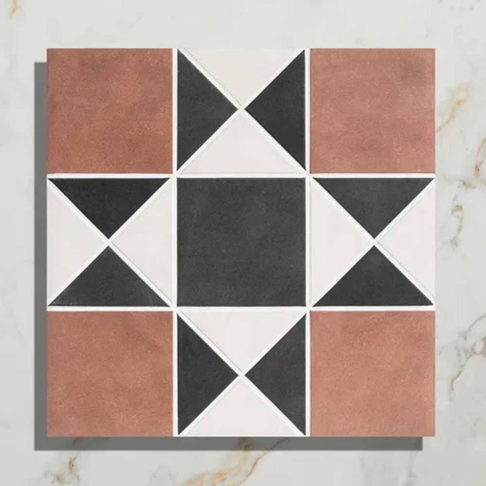 Bold Victorian style patterned floor tile in terracotta, black and white shades