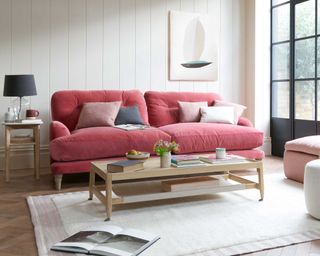 Loaf sofa in bright living room with rug and coffee table