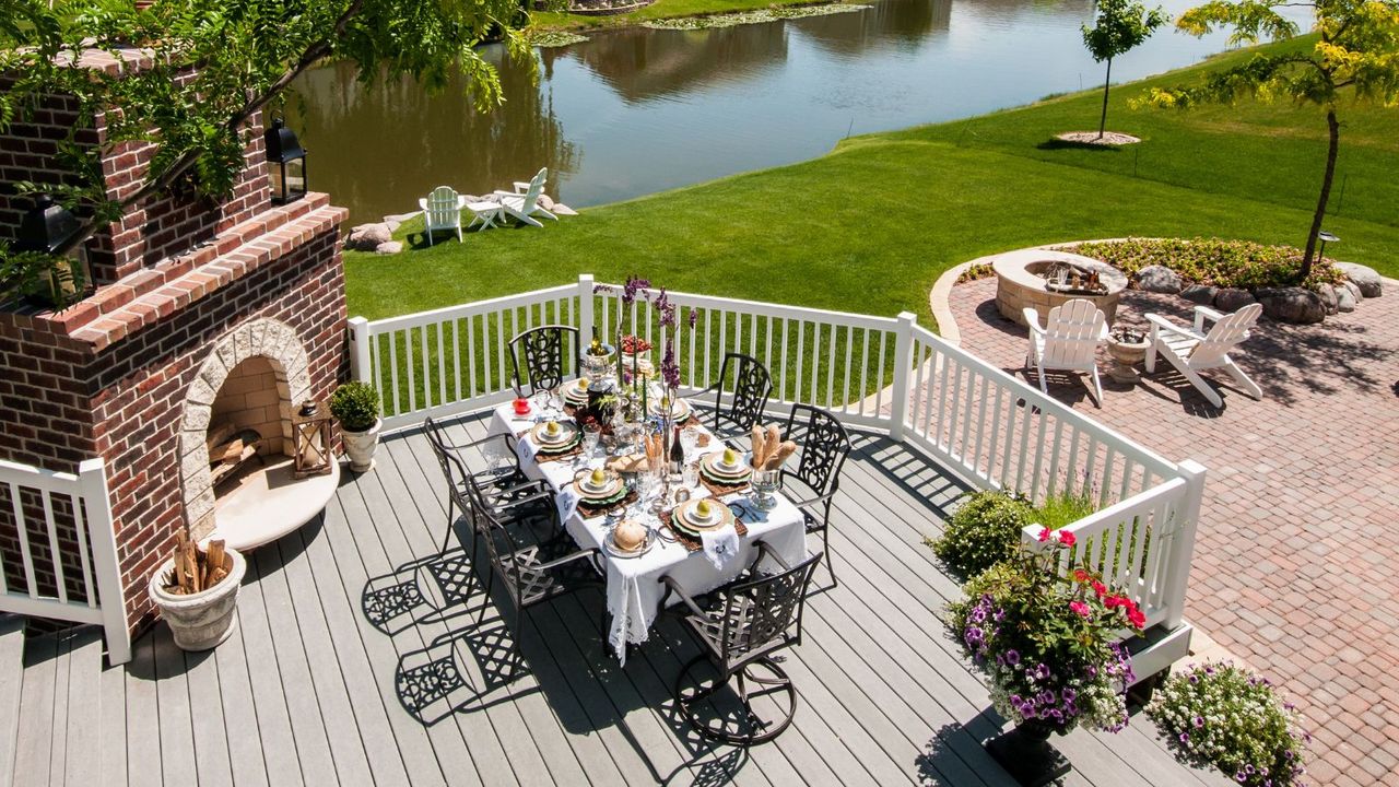 A PVC deck set for lunch overlooking a lake